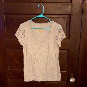 Cute gray top with lace designs.